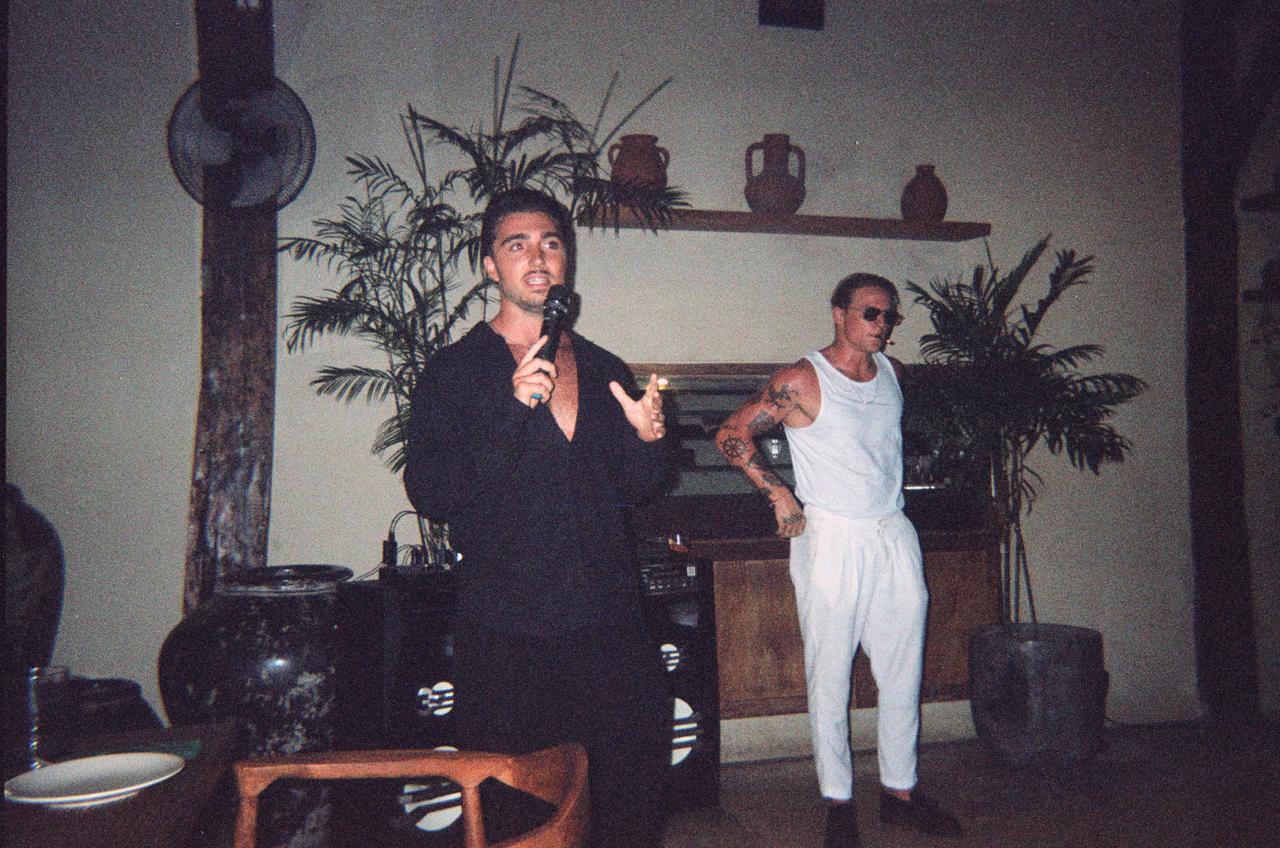 Dan West speaking into a microphone